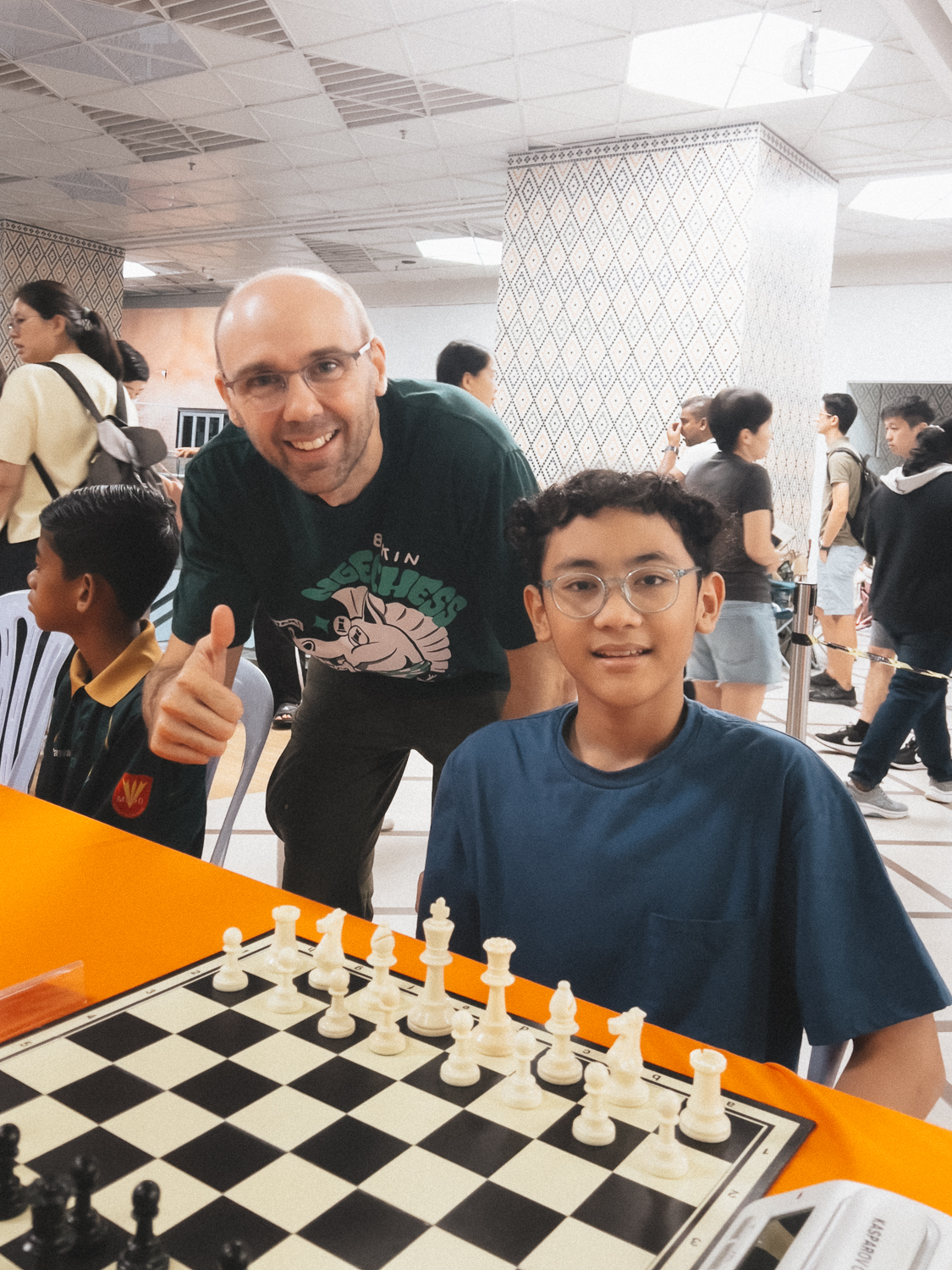 Naro with Grandmaster David Smerdon at a chess event in Malaysia